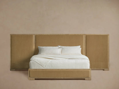 Darien extended panel bed with oak frame, tan upholstered headboard & bed frame. Crisp white bedding.