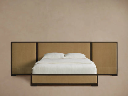Darien Extended Panel Bed, tan upholstered headboard with dark wood frame, white bedding, on a wood floor.