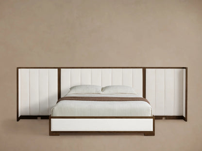 Front view of the Darien Extended Channel-Stitched Shelter Bed, featuring a dark wood frame, white channel-stitched upholstery, and white bedding with a brown throw.