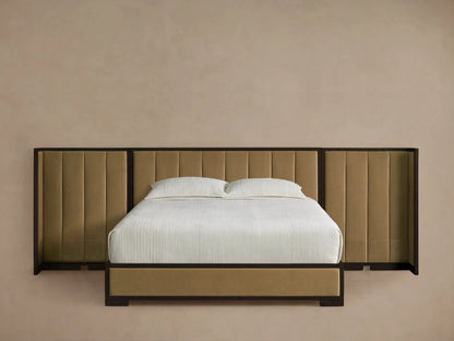 Darien Extended Channel-Stitched Shelter Bed with beige upholstered panels, dark wood frame, white bedding, wood floor.
