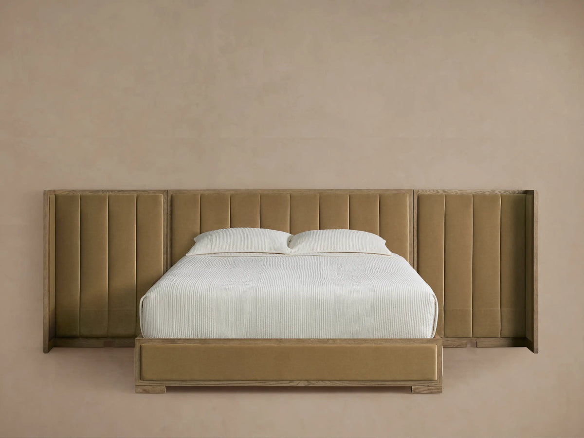 Darien Extended Channel-Stitched Shelter Bed. Light oak frame with brownish-gold channel-stitched headboard, extended side panels, white bedding.