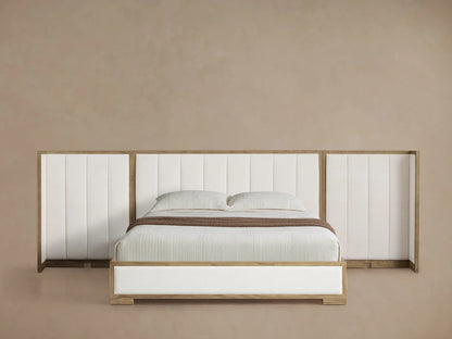 Darien Extended Channel-Stitched Shelter Bed with light oak frame, white channel-stitched upholstery, white bedding, brown throw.