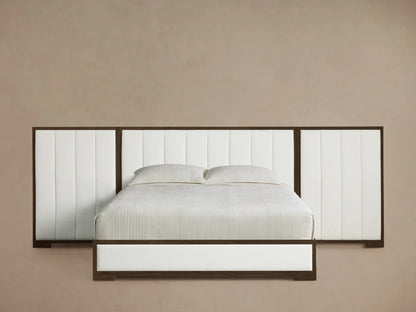 Front view of the Darien Extended Channel-Stitched Panel Bed featuring white channel-stitched upholstered panels and a dark wood frame.