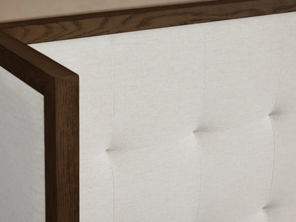 Front view of the Darien Extended Box-Tufted Shelter Bed with white upholstered, box-tufted headboard and dark oak frame.