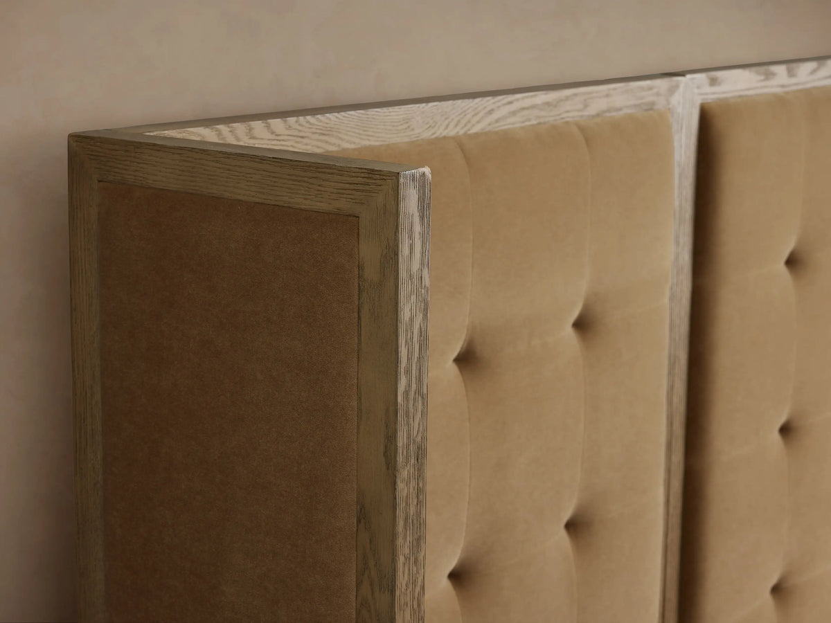 Darien Extended Box-Tufted Shelter Bed: Tan upholstered, box-tufted headboard, light oak frame, white bedding.
