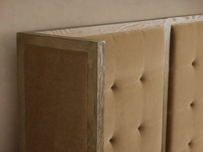 Darien Extended Box-Tufted Shelter Bed: Tan upholstered, box-tufted headboard, light oak frame, white bedding.