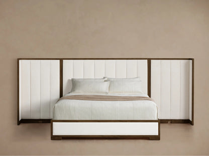Side profile of the Darien Extended Channel-Stitched Shelter Bed, featuring a dark wood frame with off-white upholstered panels and white bedding.