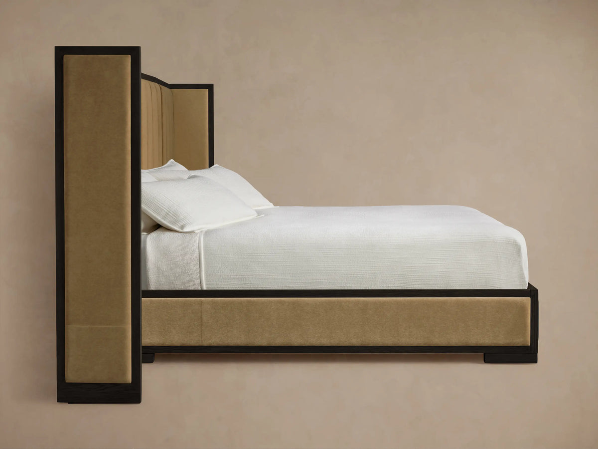 Darien Extended Shelter Bed corner: dark oak frame surrounds beige channel-stitched upholstered panel.