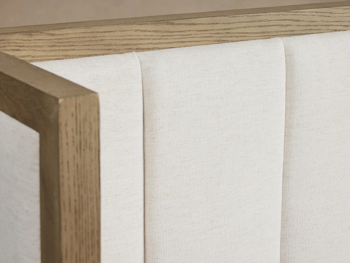 Darien Extended Channel-Stitched Shelter Bed: White channel-stitched upholstered headboard & extended side panels, light oak frame, white bedding.