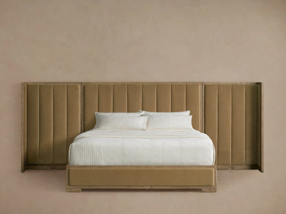 Darien Extended Channel-Stitched Shelter Bed, tan upholstered, oak frame, white bedding, on wood floor.