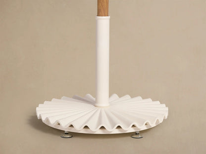 Top view of a Cream Umbrella with a metallic finial and decorative fringe along the canopy edge.
