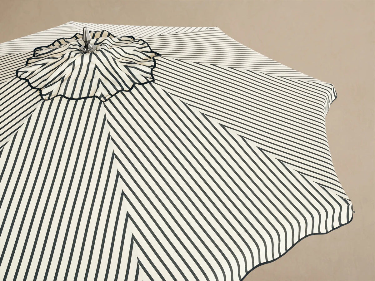 Front view of an octagonal black and white geometric striped pattern with a central wavy design.