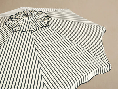 Front view of an octagonal black and white geometric striped pattern with a central wavy design.