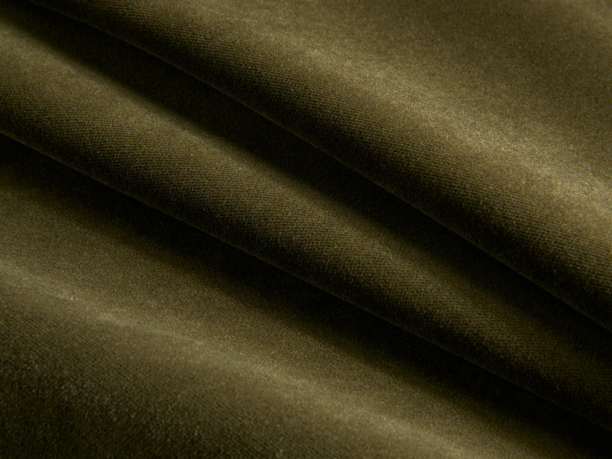 Close-up of the olive green plush fabric on the Deacon Ottoman.