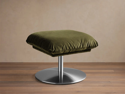 Front view of the Olive green Deacon Ottoman with a plush velvet cushion and round brushed silver metal base.