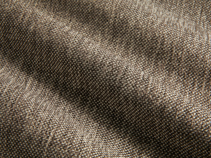 Close-up of the brown woven upholstery fabric on the Deacon Ottoman.