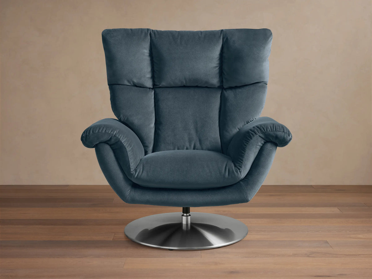 Front view of the Slate Blue Deacon Swivel Recliner, showing its high back, padded armrests, side lever, and metallic swivel base.
