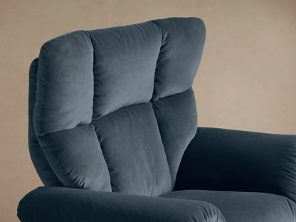 Close-up of the slate blue Deacon Swivel Recliner's plush armrest with a silver side reclining lever.