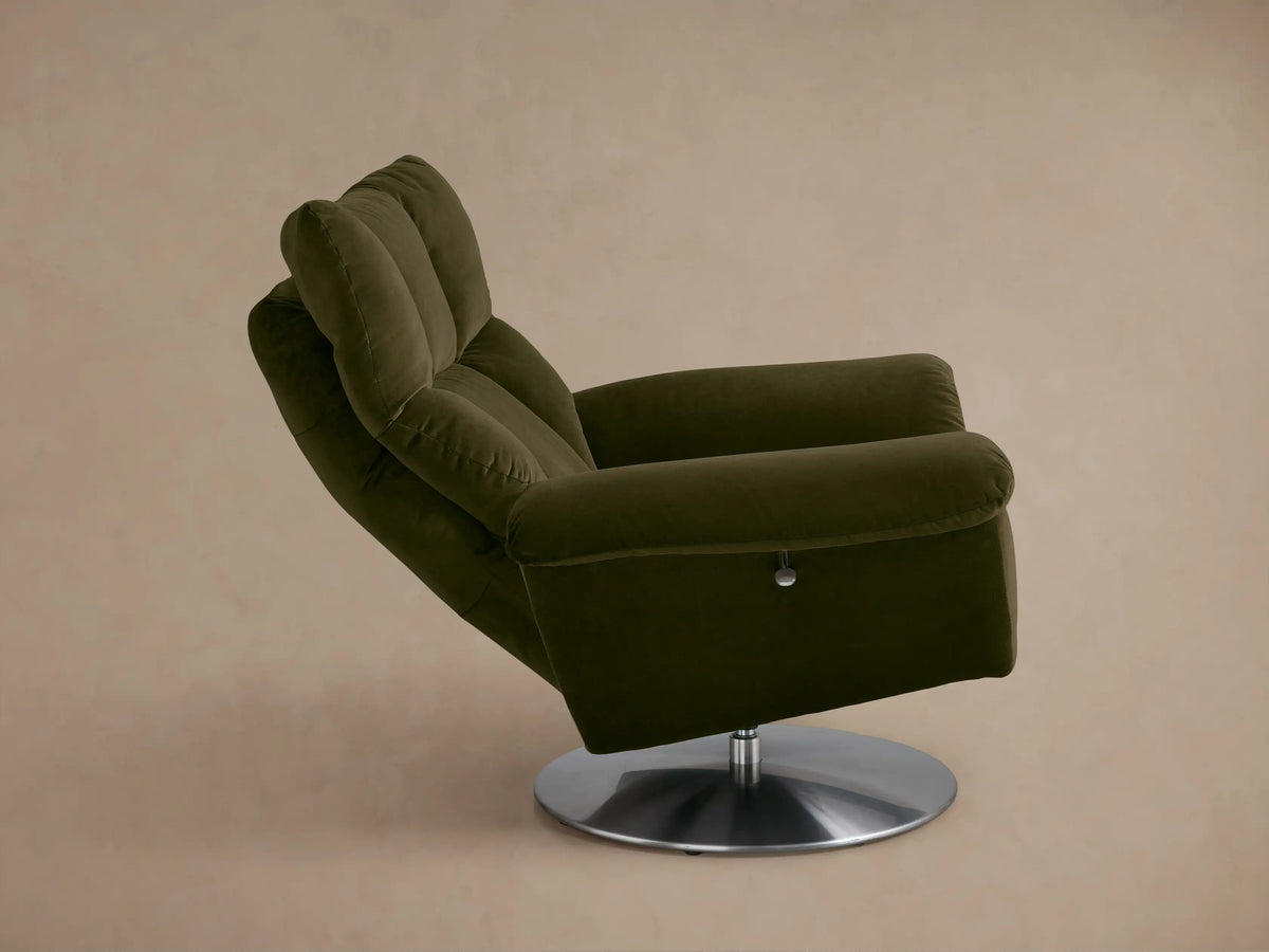 Rear view of the Olive Green Deacon Swivel Recliner with a padded backrest and a round silver swivel base.