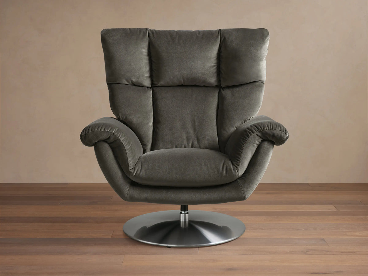 Front view of the deep green Deacon Swivel Recliner, featuring a padded backrest, plush cushions, and a silver swivel base.