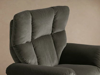 Close-up of the gray Deacon Swivel Recliner's plush armrest and side-mounted reclining lever.