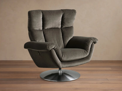 Side view of the dark gray Deacon Swivel Recliner with a channeled backrest and silver swivel base, in a reclined position.