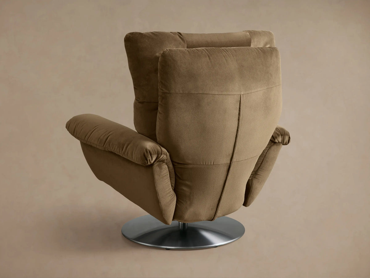 Close-up of the taupe Deacon Swivel Recliner, showing its plush, segmented back cushioning and armrest.