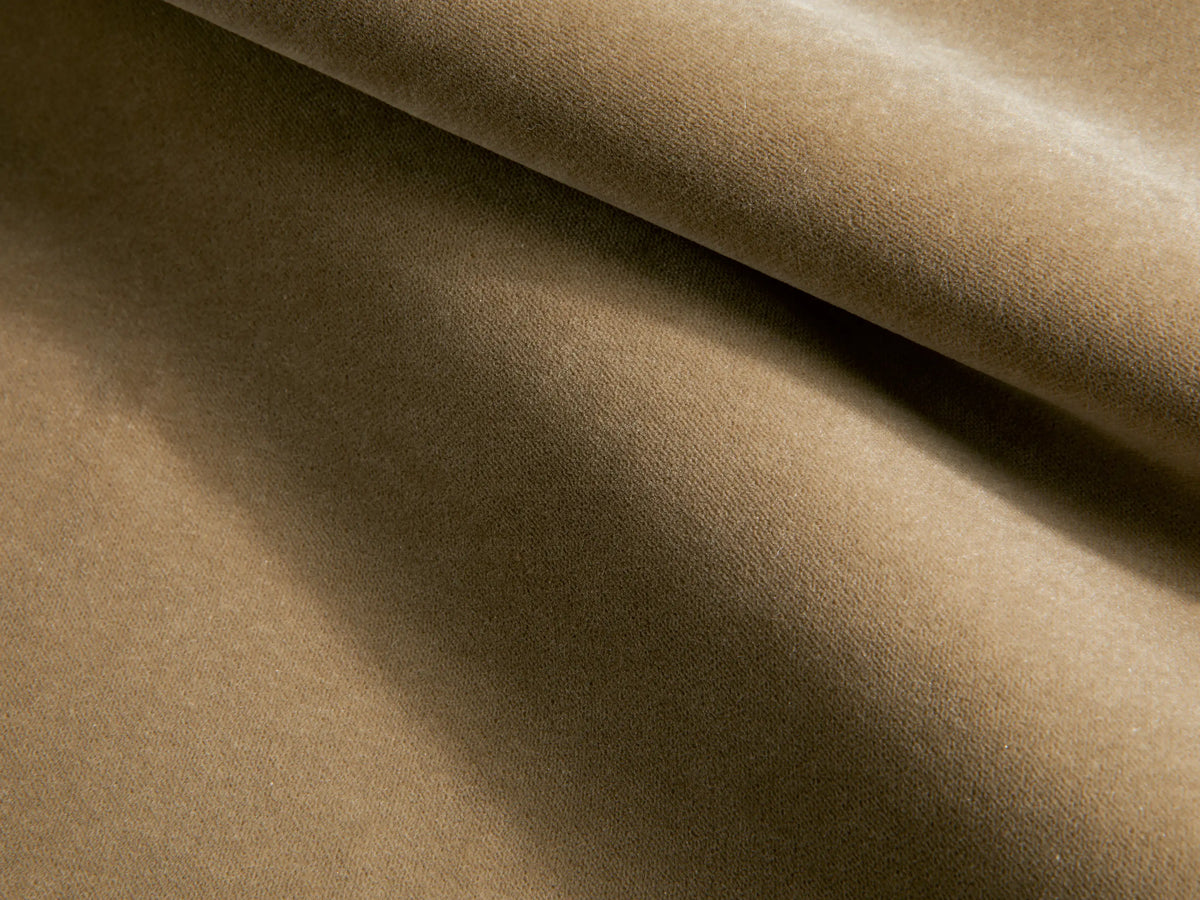 Side view of a taupe Deacon Swivel Recliner in a reclined position, featuring plush upholstered sections and a silver swivel base.