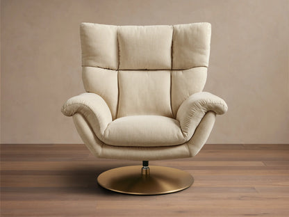 Front view of the cream Deacon Swivel Recliner, showing its plush tufted backrest, padded rolled arms, and round gold swivel base.