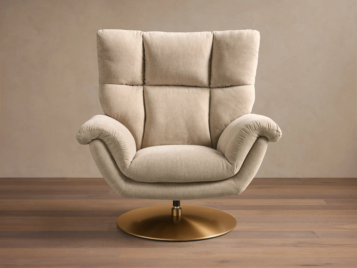 Front view of the beige Deacon Swivel Recliner with a tufted backrest, padded armrests, and a golden circular base.