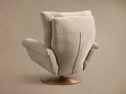 Close-up of the beige fabric armrest of the Deacon Swivel Recliner, with a brass recliner lever.