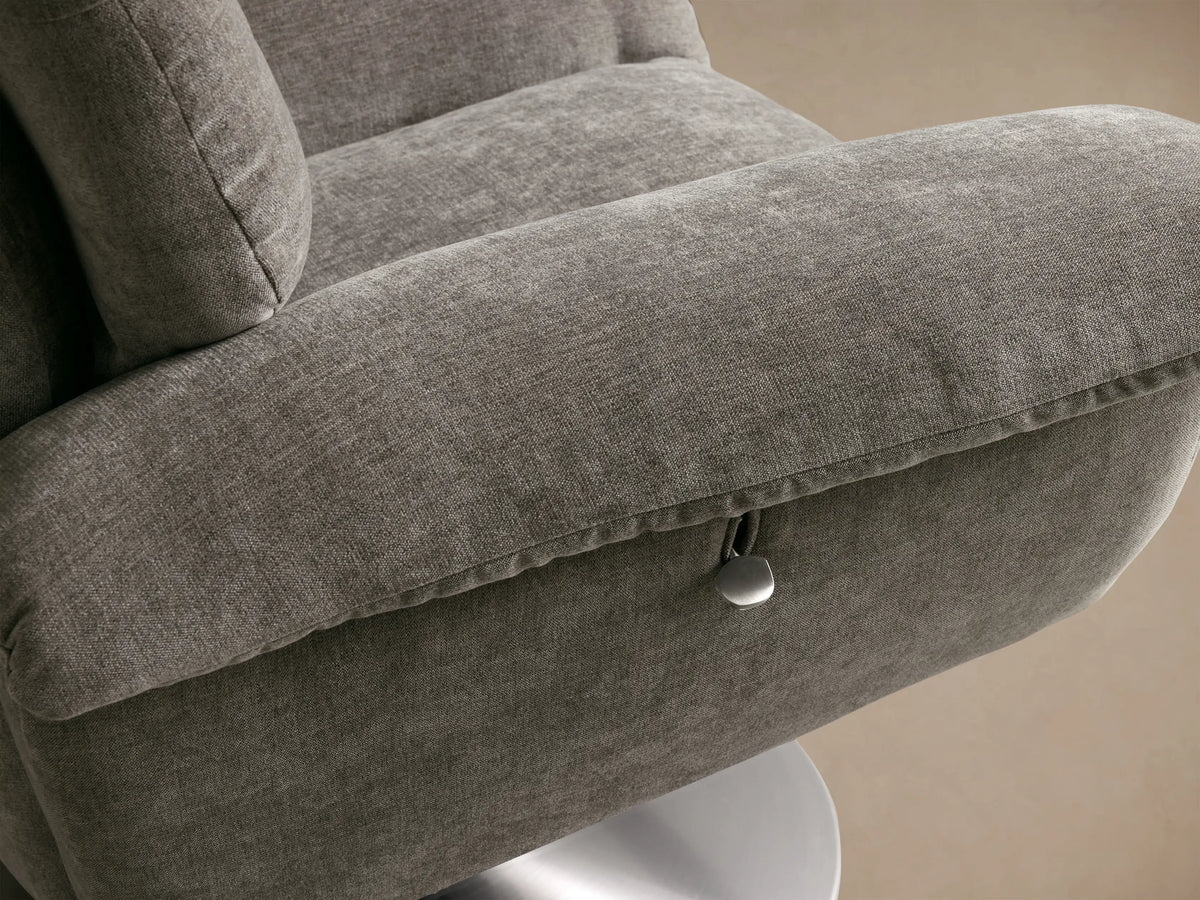 Close-up of the gray Deacon Swivel Recliner, highlighting its channel-tufted backrest and textured upholstery.