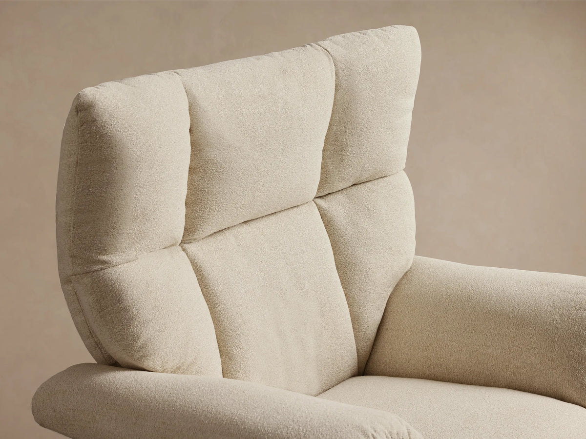 Front view of a cream Deacon Swivel Recliner, featuring a high back with three padded sections, plush arms, and a silver swivel base.