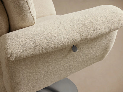 Close-up of the cream Deacon Swivel Recliner, highlighting its tufted backrest and textured fabric.