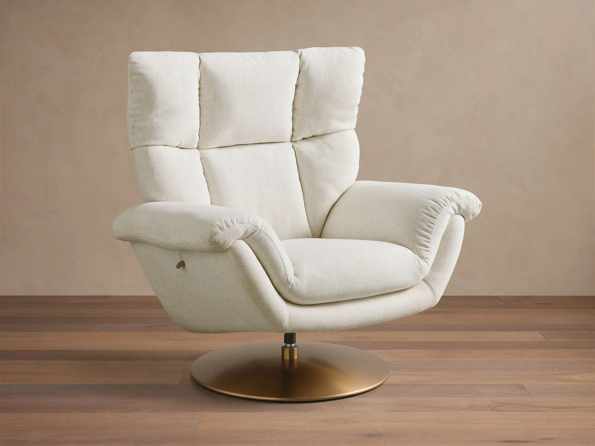 Close-up of the Cream Deacon Swivel Recliner armrest, showing its textured upholstery and a small brass reclining lever.