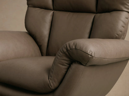 Front view of the Taupe Deacon Leather Swivel Recliner, featuring a plush, sectioned back, rolled armrests, and a black circular base.