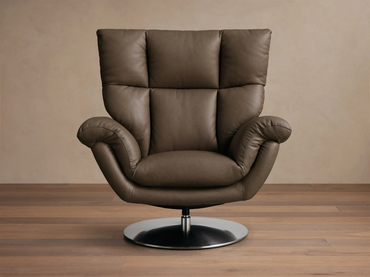 Front view of the brown Deacon Leather Swivel Recliner with a tufted back and a round metallic base.