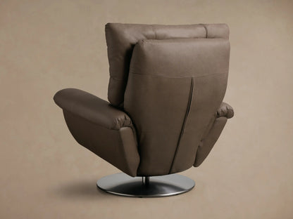 Close-up of the taupe pebbled leather armrest and segmented back of the Deacon Leather Swivel Recliner™.