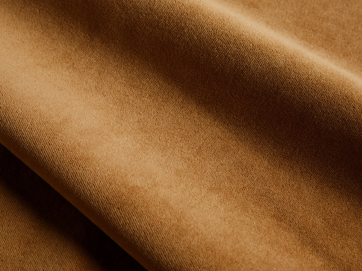 Close-up of the cognac velvet fabric on the Malta Two-Piece Chaise Sectional.