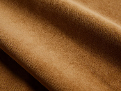 Close-up of the cognac velvet fabric on the Malta Two-Piece Chaise Sectional.