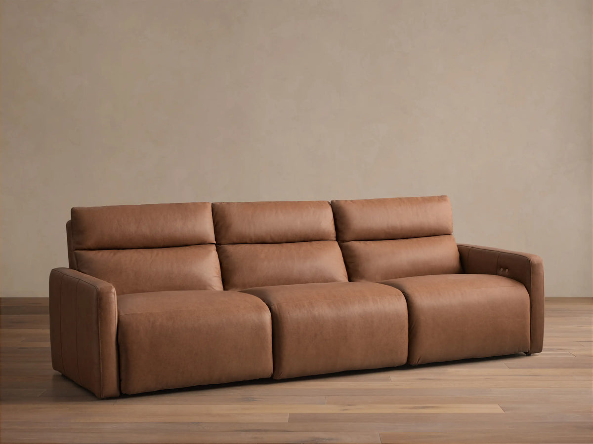 Rowland Tailored Leather 3-Piece Motion Modular Sofa, saddle brown leather, plush cushions, front view.