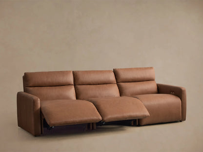 Rowland Tailored Leather Three-Piece Motion Modular Sofa in warm brown, right recliner extended, against a beige wall.