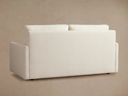 Kipton Luxury Sleeper Sofa shown in beige, partially unfolded with white mattress on black frame, set against a neutral background.