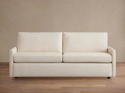 Kipton Slim Arm Luxury King Sleeper Sofa in Wiley Parchment, a light beige fabric, with slim arms, two seat and back cushions.