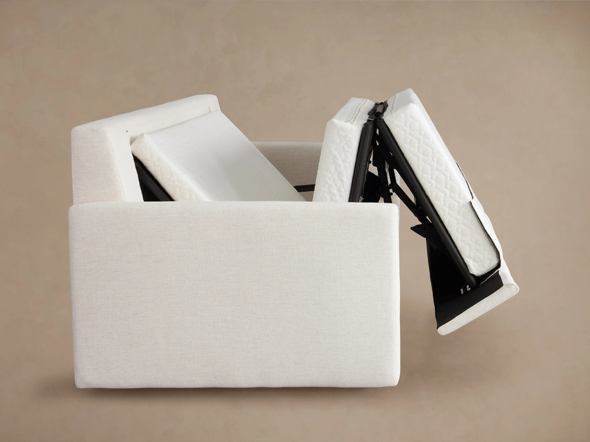 Kipton Luxury Sleeper Sofa in an open position showing a plush, white, quilted mattress extending from the sofa frame.