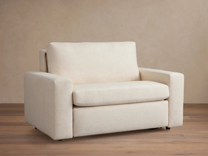 Kipton Wide Arm Luxury Twin Sleeper Chair in cream fabric with a plush backrest, wide armrests, and a sleek, modern design.