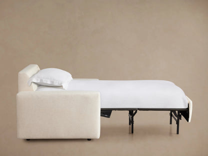 Kipton Wide Arm Luxury Twin Sleeper Chair in cream fabric, shown from the back. Features broad arms and a plush, squared backrest against a neutral background.