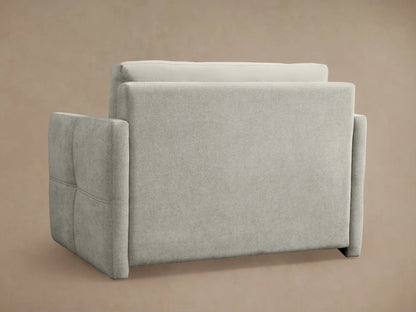 Reece Twin Sleeper Chair in bed mode, showing a white quilted mattress with a seam, framed by light grey upholstered head/footrests.
