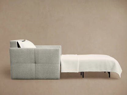 Side view of light gray Reece Twin Sleeper Chair, partially extended as a bed with white mattress and black support legs.