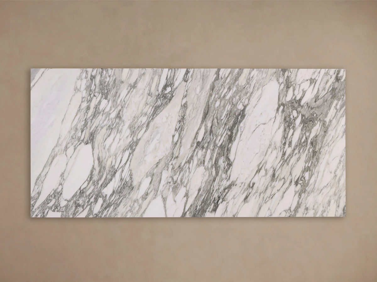 Front view of a rectangular white marble slab with intricate grey and black natural veining.